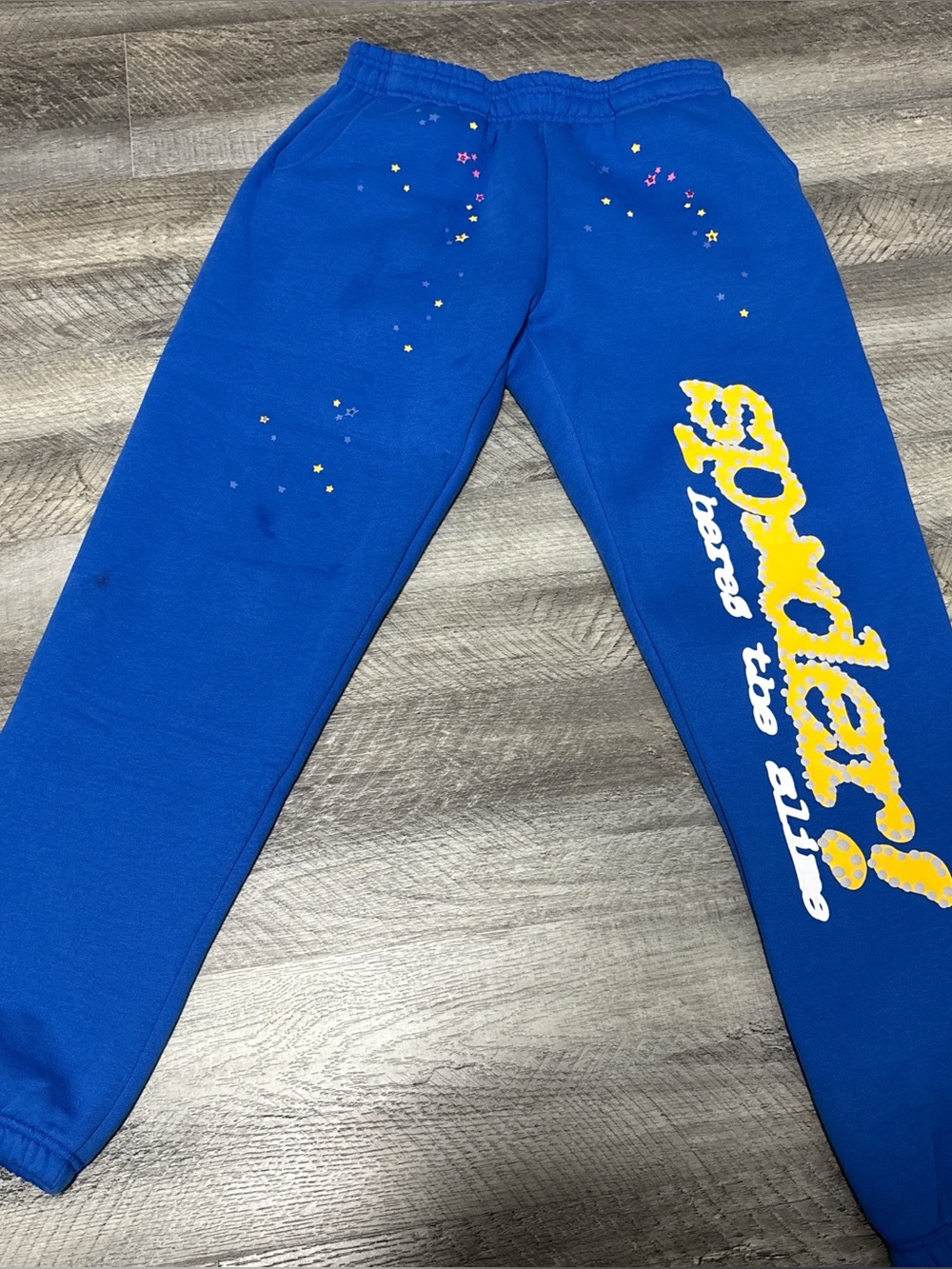 Blue and yellow Sp5der pants